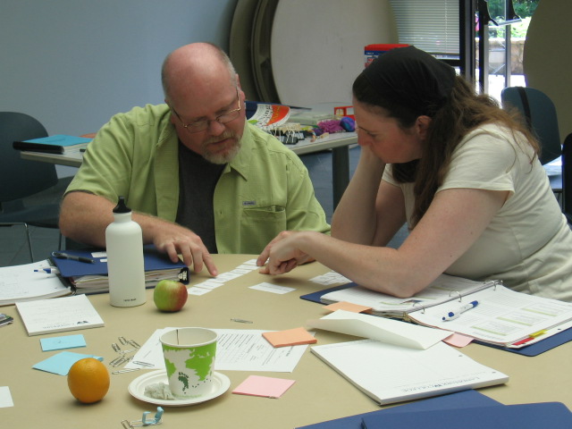 An instructor reviews material with a student